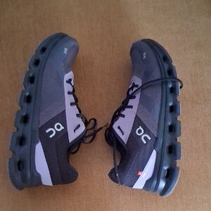 On Running Black and Purple Shoes